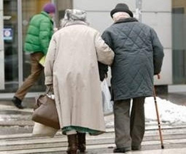 Two older people walking